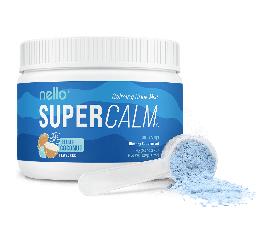 Container of blue coconut flavored calming drink mix with a scoop of powder.